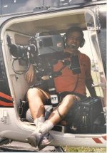 Phil in Helicopter working.jpg